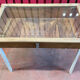 Old table showcase in walnut wood and glass, to install, store model with heavy glass