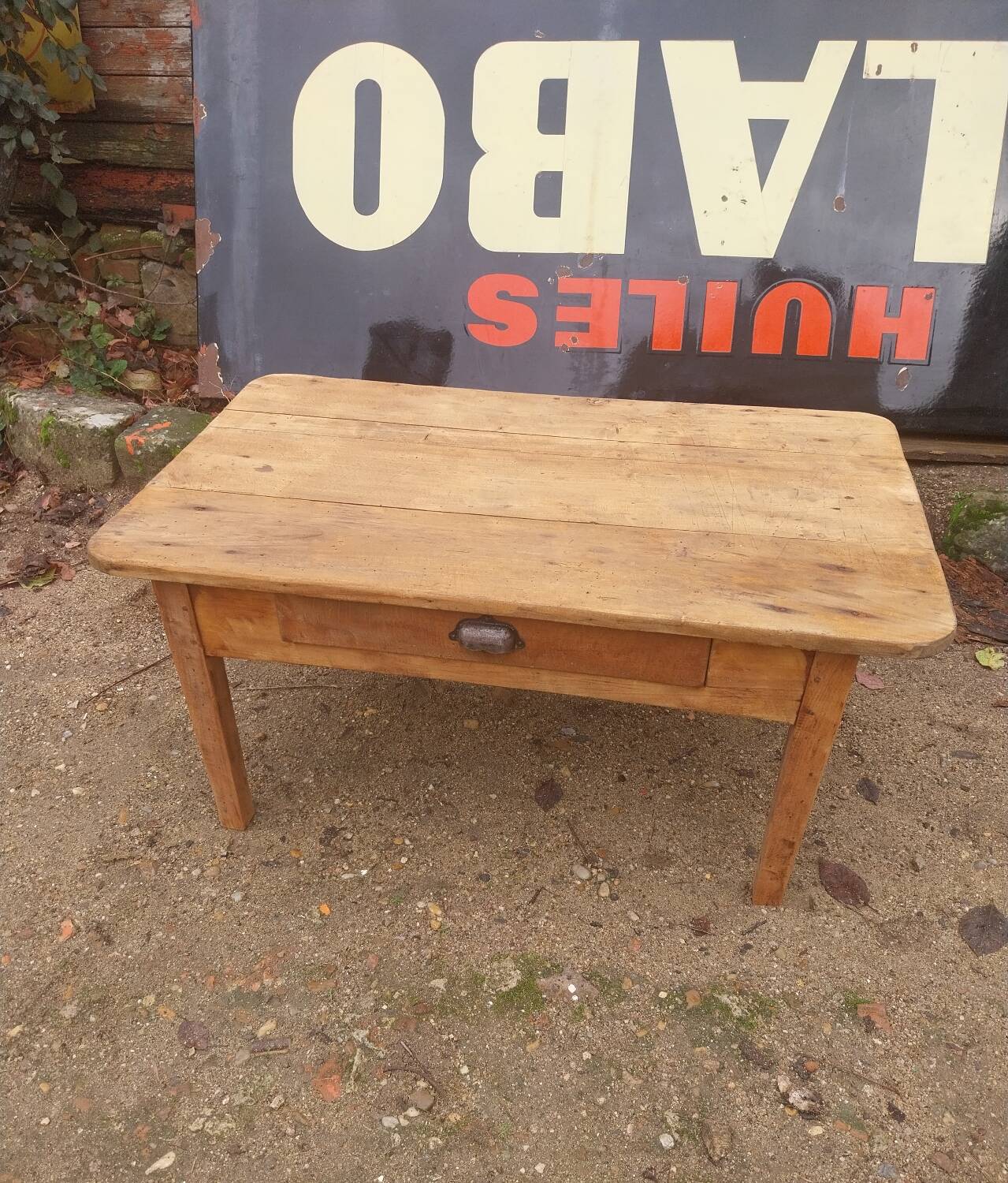 Wooden coffee table with a drawer