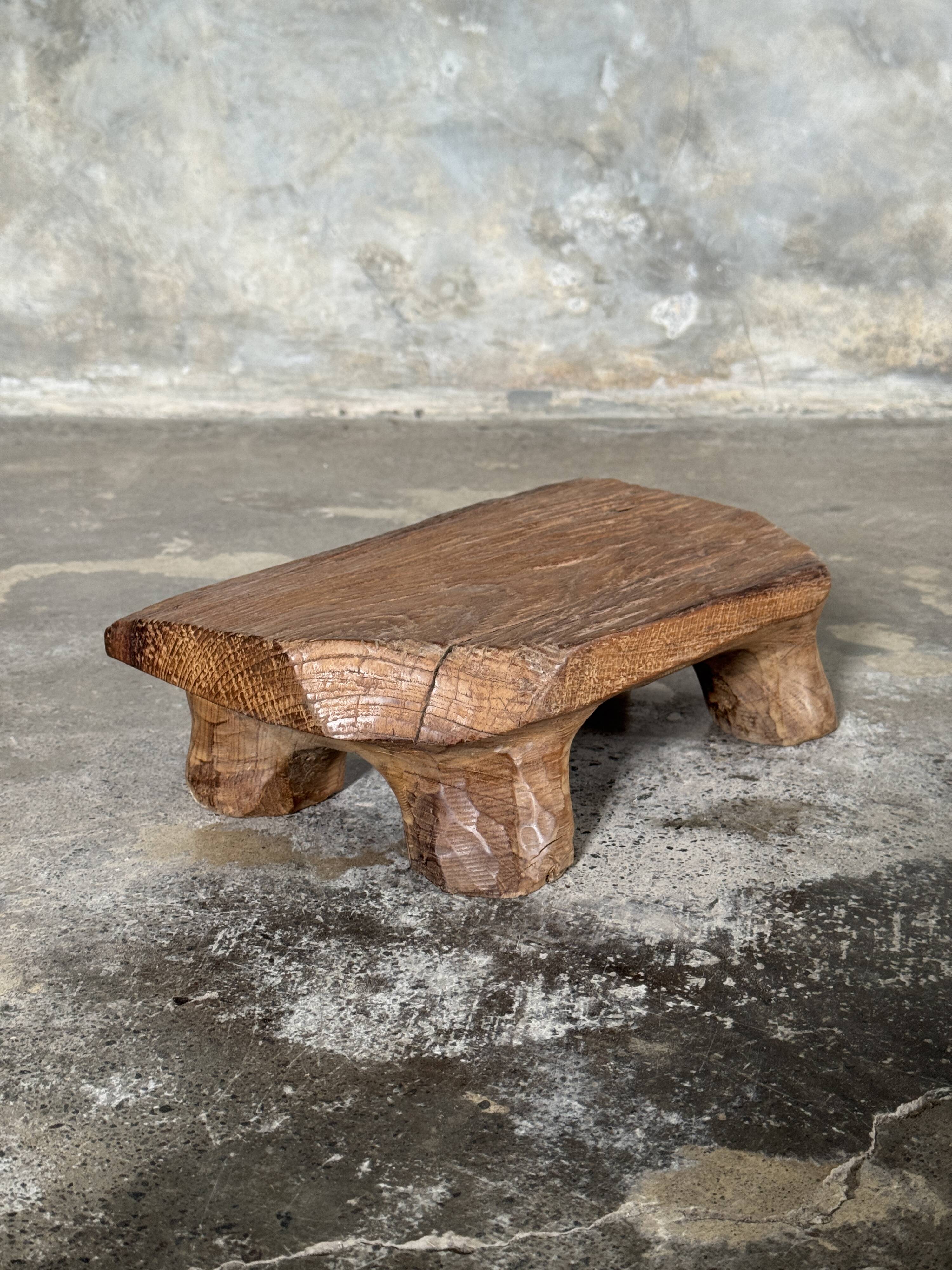 Small stool, teak footrest with short cut corners.