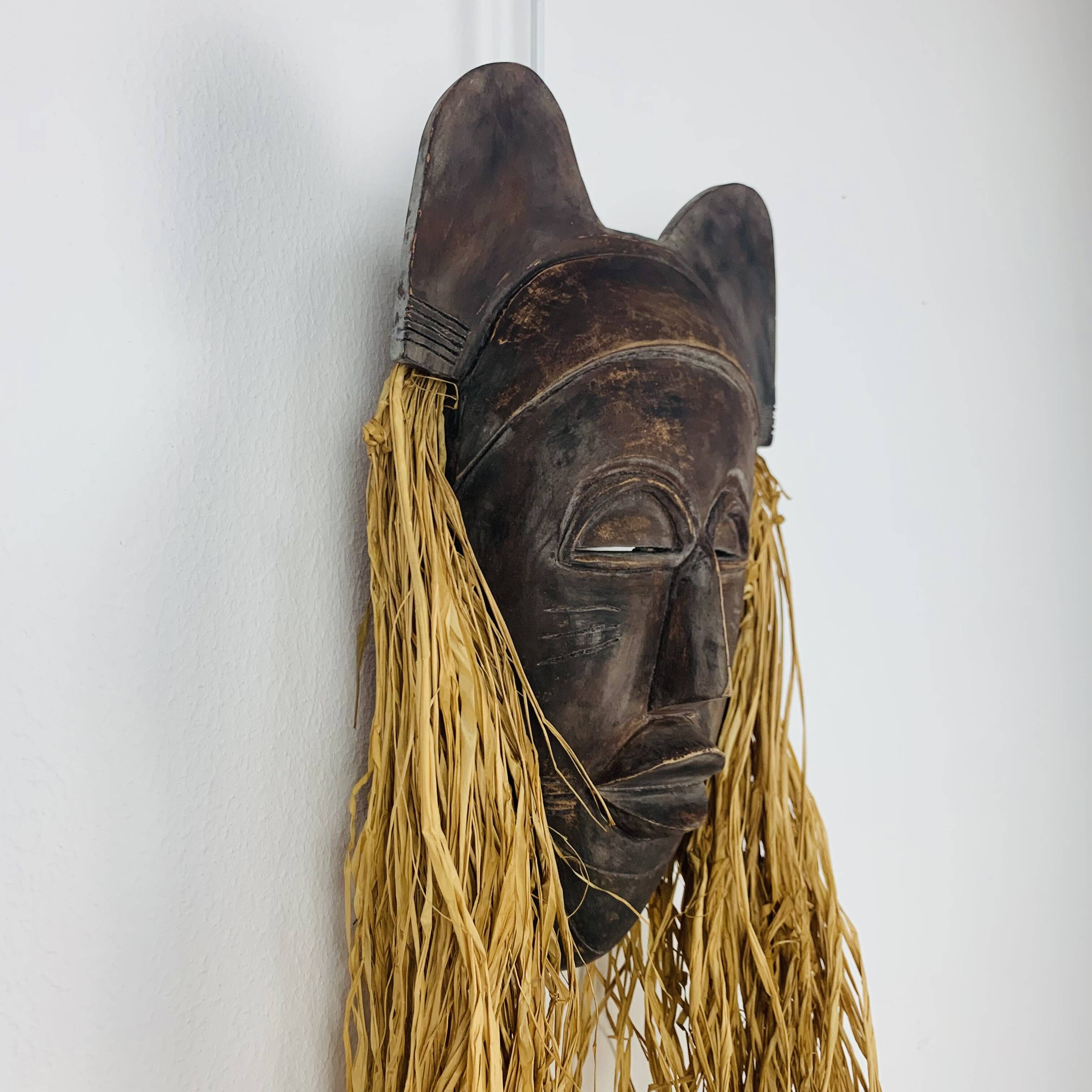 African ceramic and raffia mask signed BJ