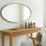 Oval Art Deco mirror with vintage chrome frame from the 1970s.