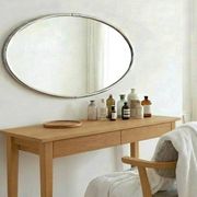 Oval Art Deco mirror with vintage chrome frame from the 1970s.