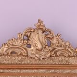 Miroir Napoléon III a riche ornementation dorée