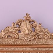 Napoleon III mirror with rich gilded ornamentation