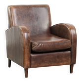 Fauteuil en peau de mouton au design intemporel et aux couleurs chaudes magnifiques.