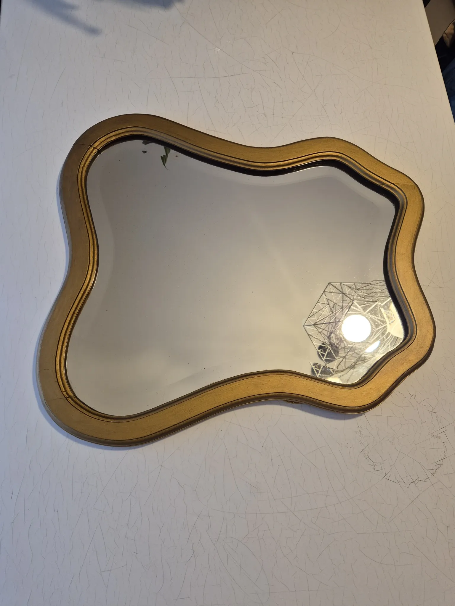 Vintage organic bevelled gold wooden mirror, Art Deco period.