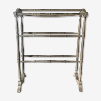 Old bathroom towel rack in patinated wood