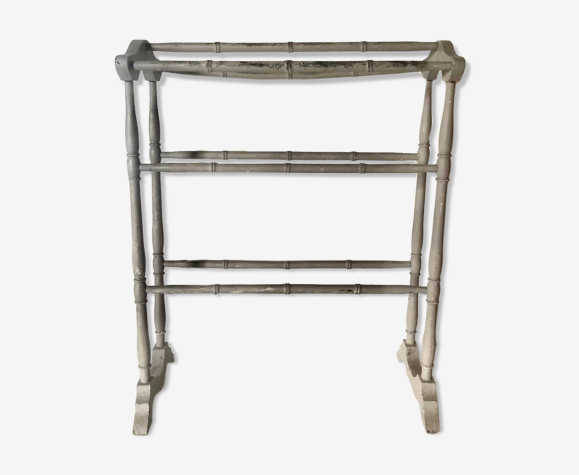 Old bathroom towel rack in patinated wood