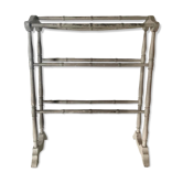 Old bathroom towel rack in patinated wood