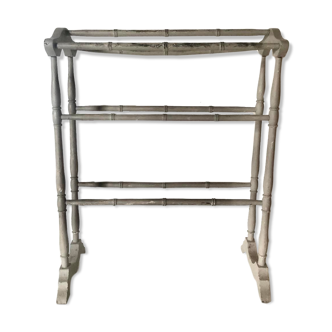 Old bathroom towel rack in patinated wood