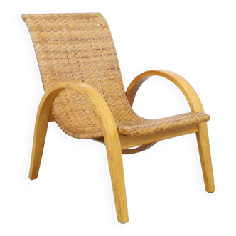 Rare fauteuil lounge en cannage et bois, années 1960