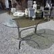 Silver metal table with smoked glass top from the 1970s.