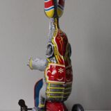 Vintage mechanical toys 'JW /Germany Western' 'Elephant on scooter'