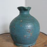 Sandstone pitcher painted in turquoise, very old pottery