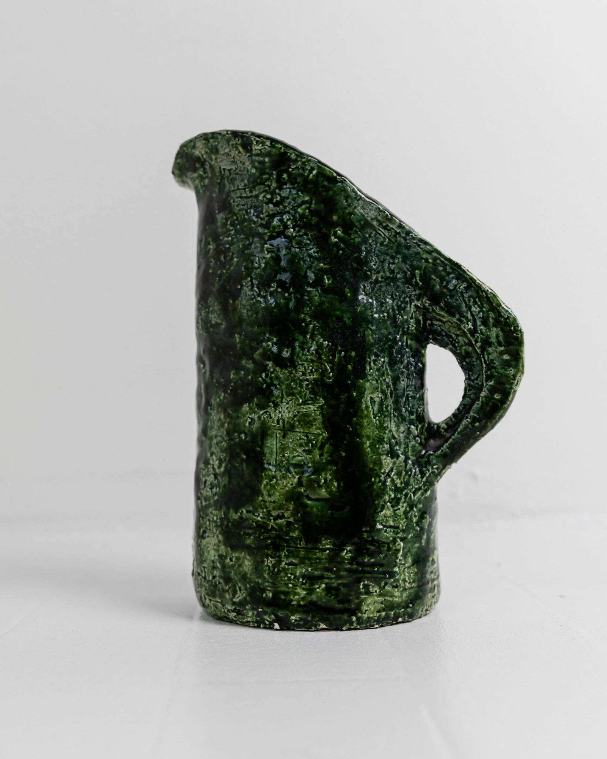 Vintage 1970s studio ceramic vase or pitcher, glazed green.