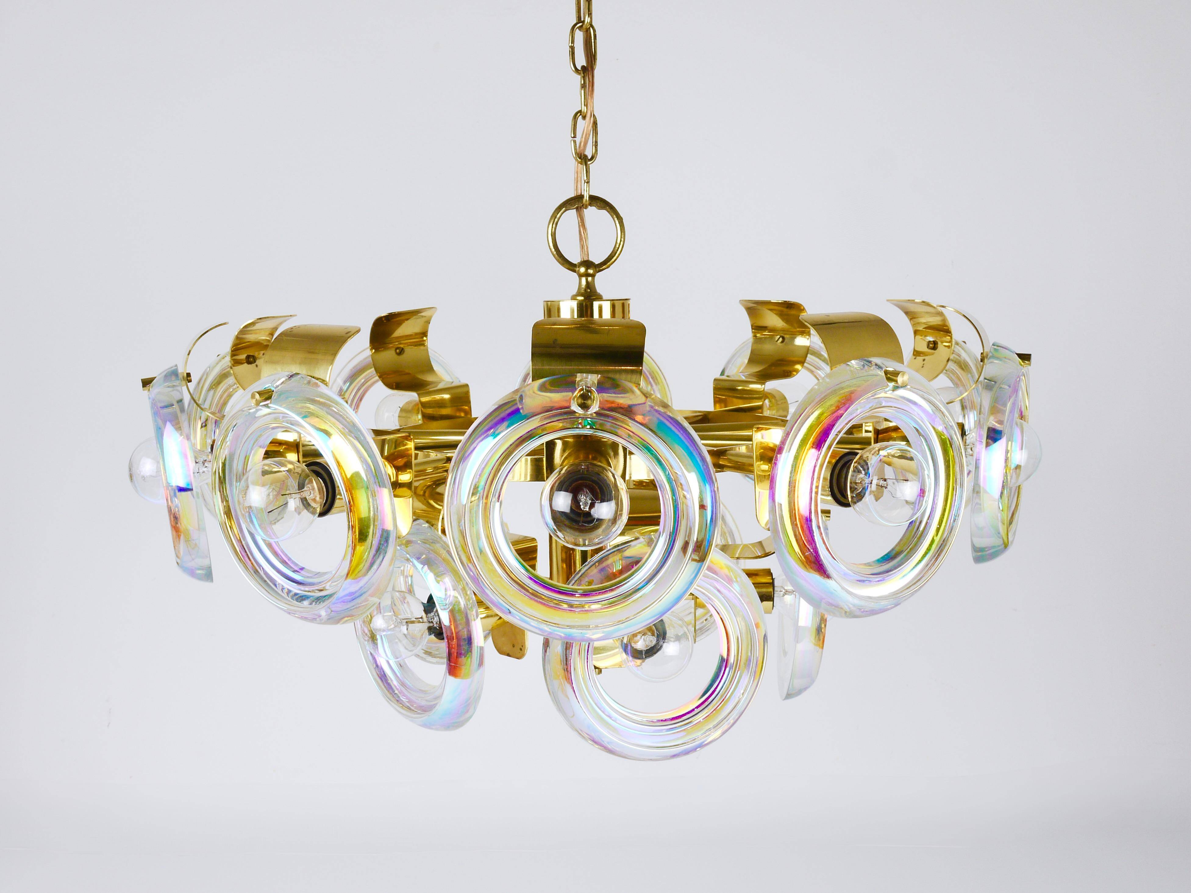 Large brass chandelier by Oscar Torlasco, rainbow optical glass rings, Italy, 1970s.