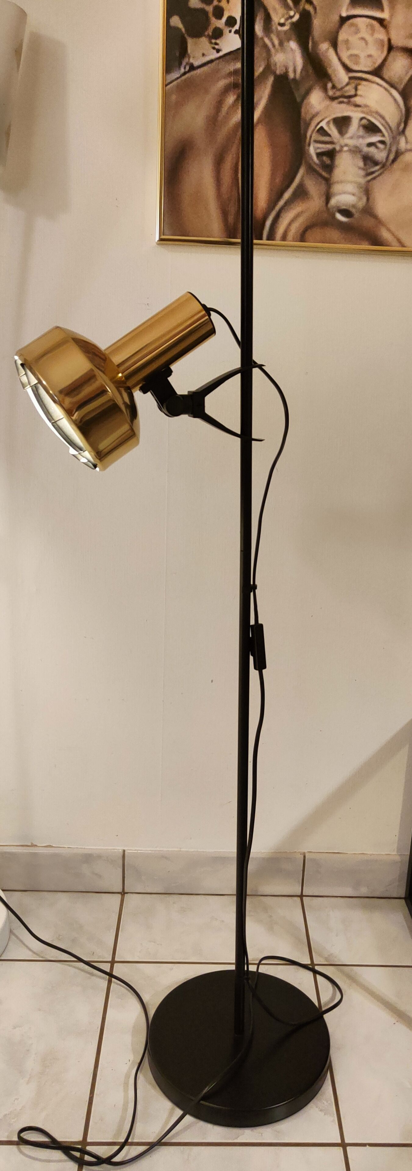Black floor lamp is gold vintage 1980
