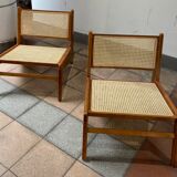 Pair of teak and canning armchairs
