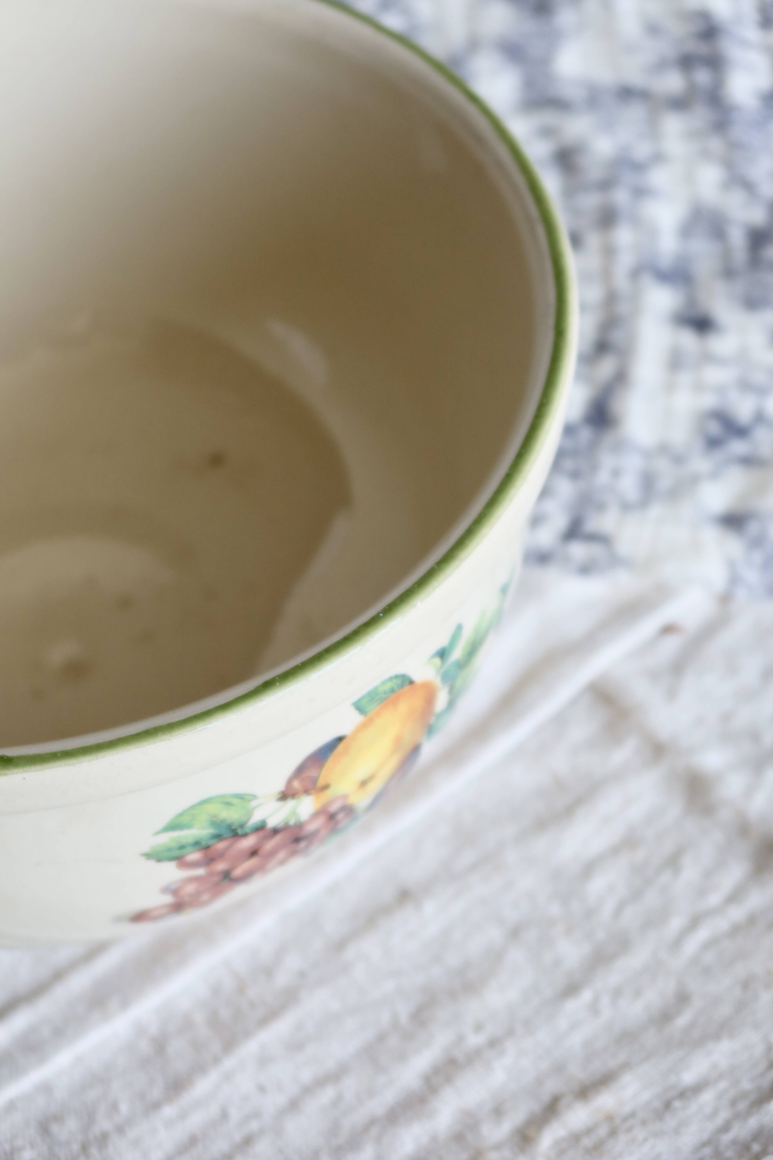 Vintage round earthenware salad bowl with fruit pattern