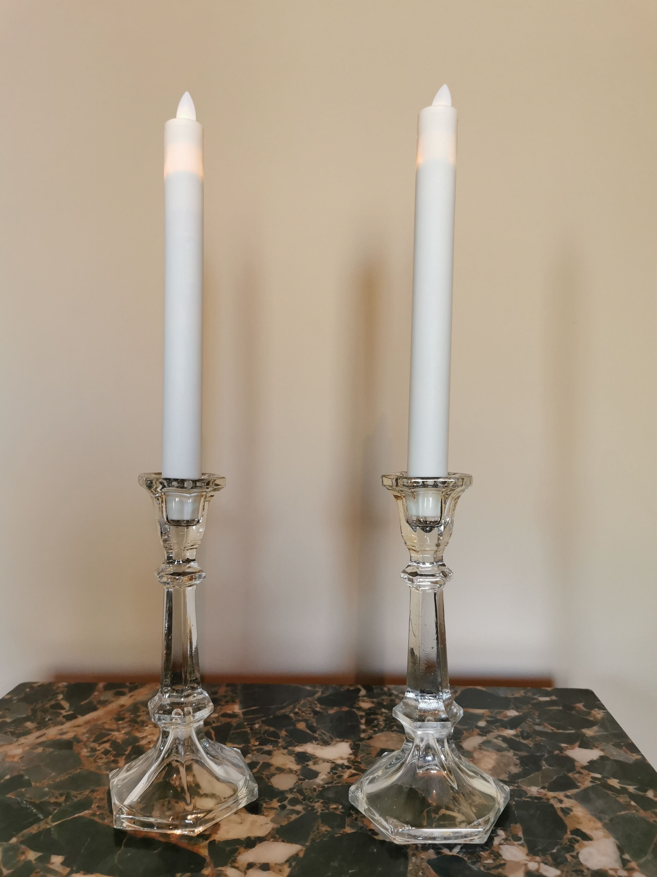 Pair of antique candle holders in transparent glass