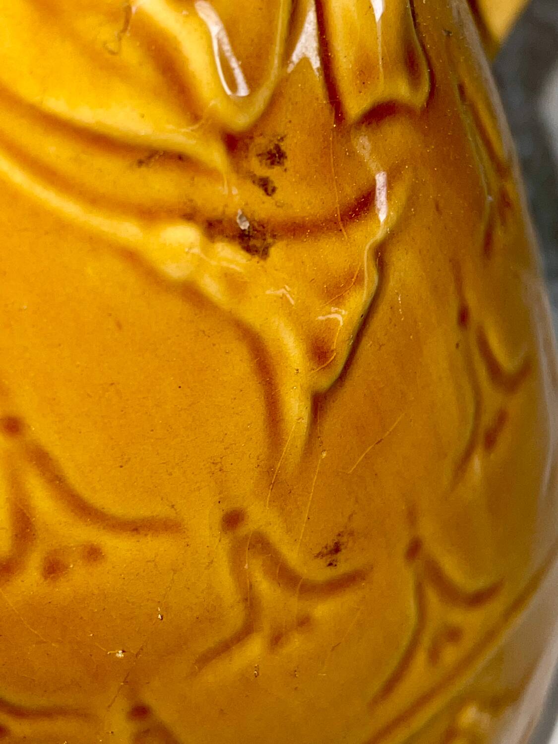 Antique pitcher with flower decoration