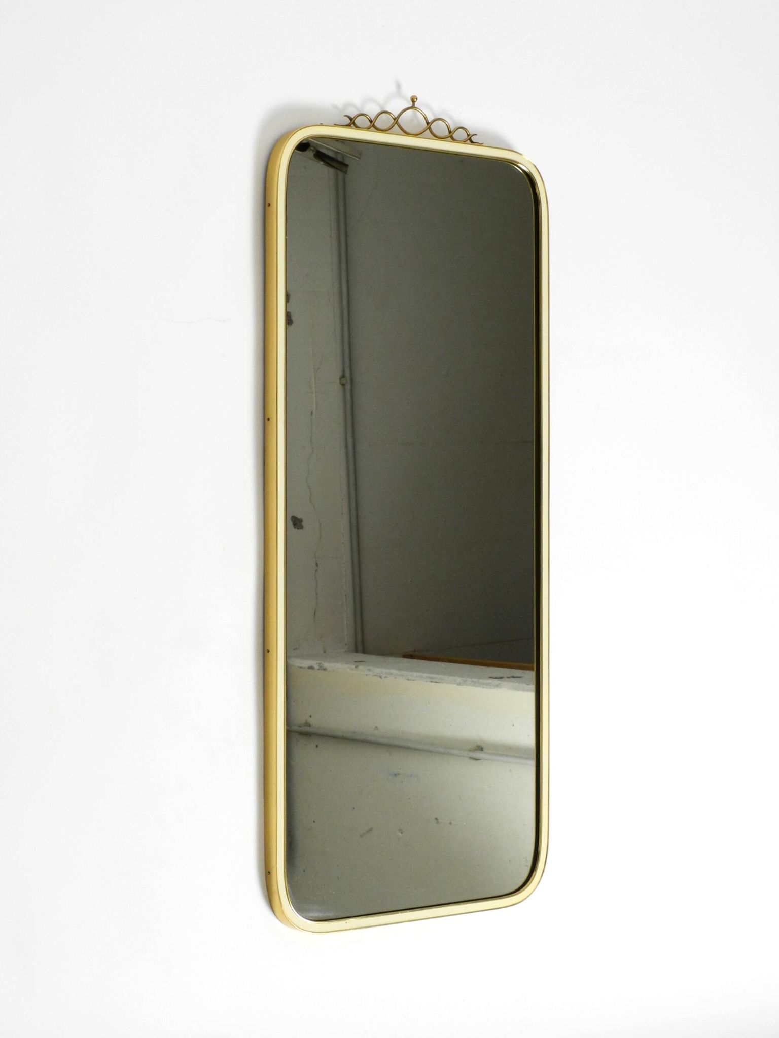 Large heavy long Mid Century brass wall mirror by Münchner Zierspiegel