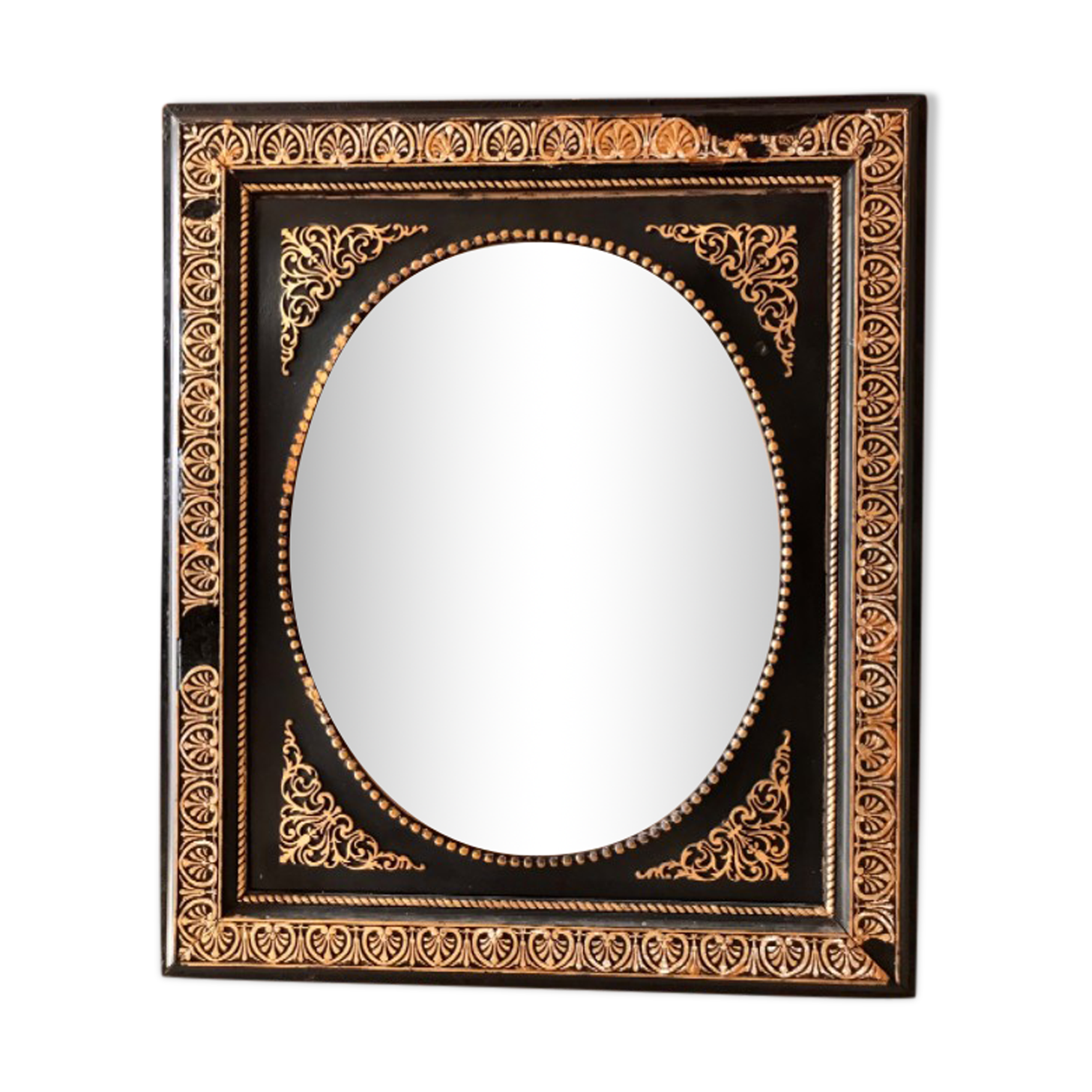 Black and gilded ebonite frame, wood and plaster 19th century