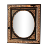 Black and gilded ebonite frame, wood and plaster 19th century