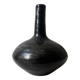 Glazed black ceramic vase with a single stem, signed, circa 1950.