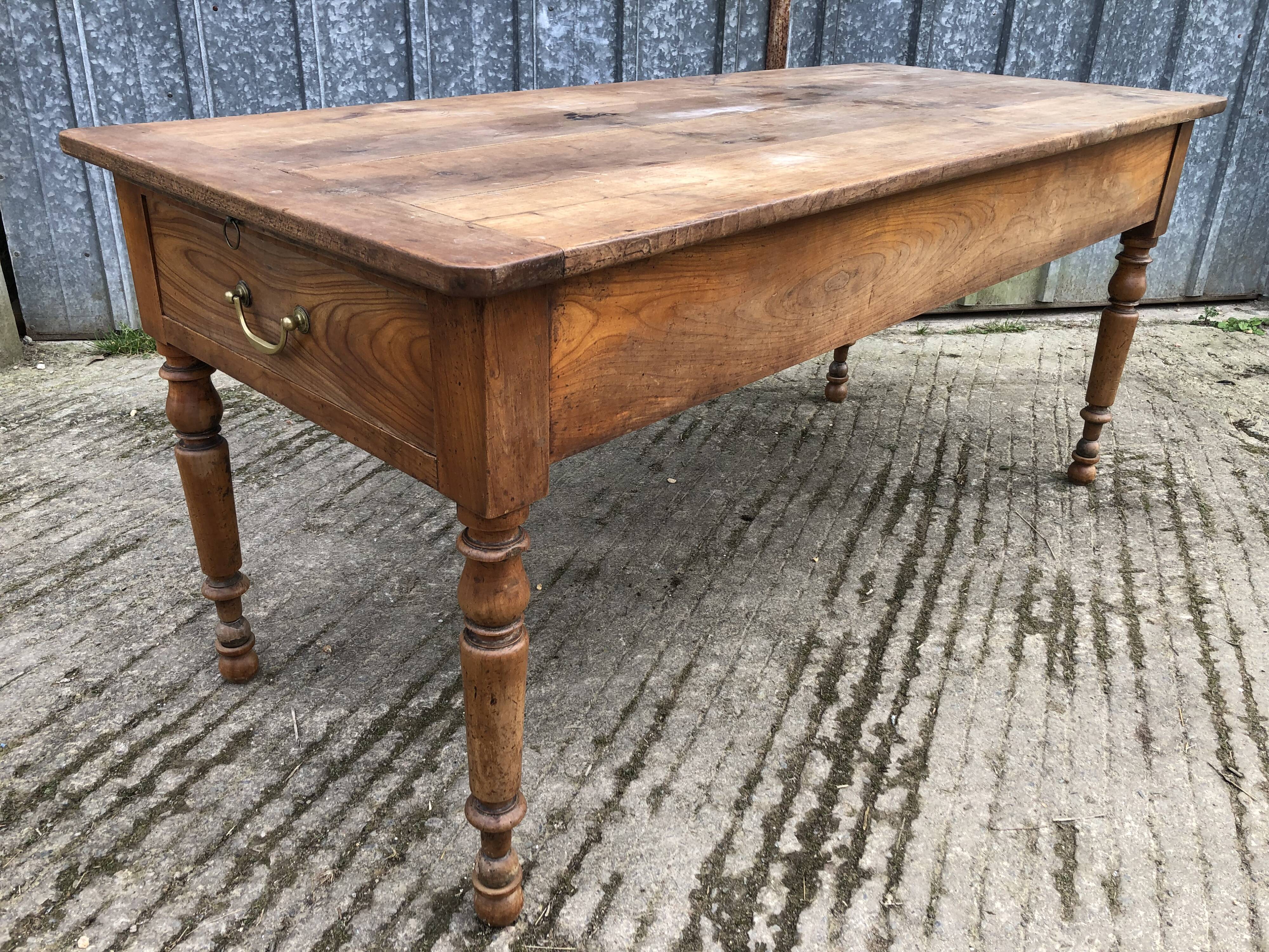 Antique cherry farmhouse table with 2 drawers and 1 pull-out
