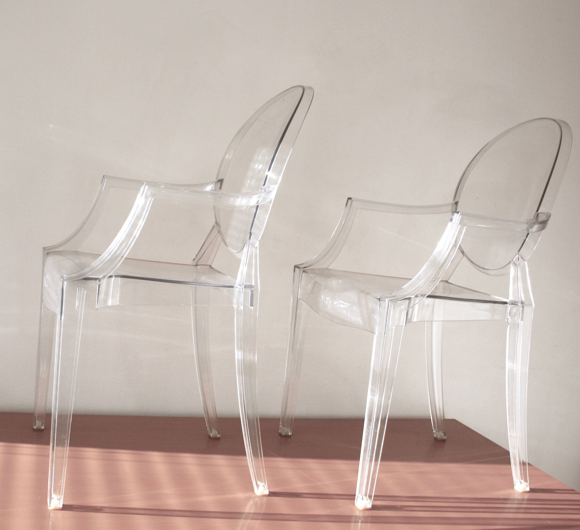Two Starck chairs transparent model Louis Ghost