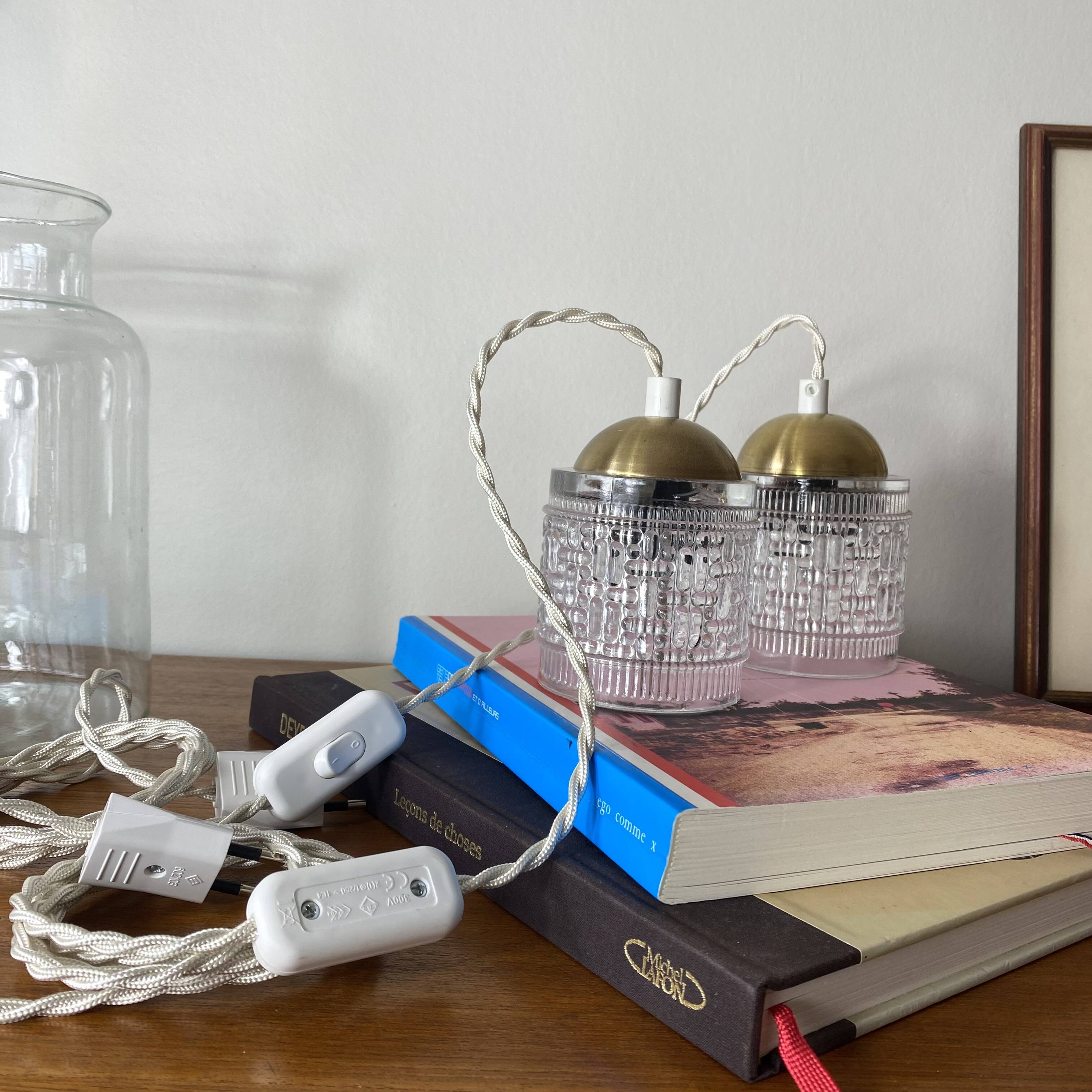 Pair of small portable tulip lamps in transparent glass.