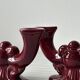 Pair of 1950s burgundy earthenware candlesticks