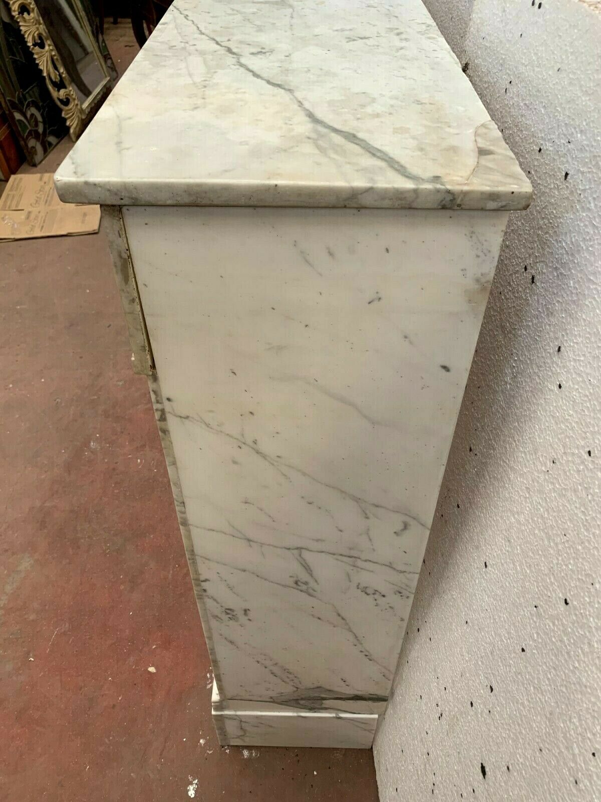 Louis XVI fireplace in 19th century white Carrara marble