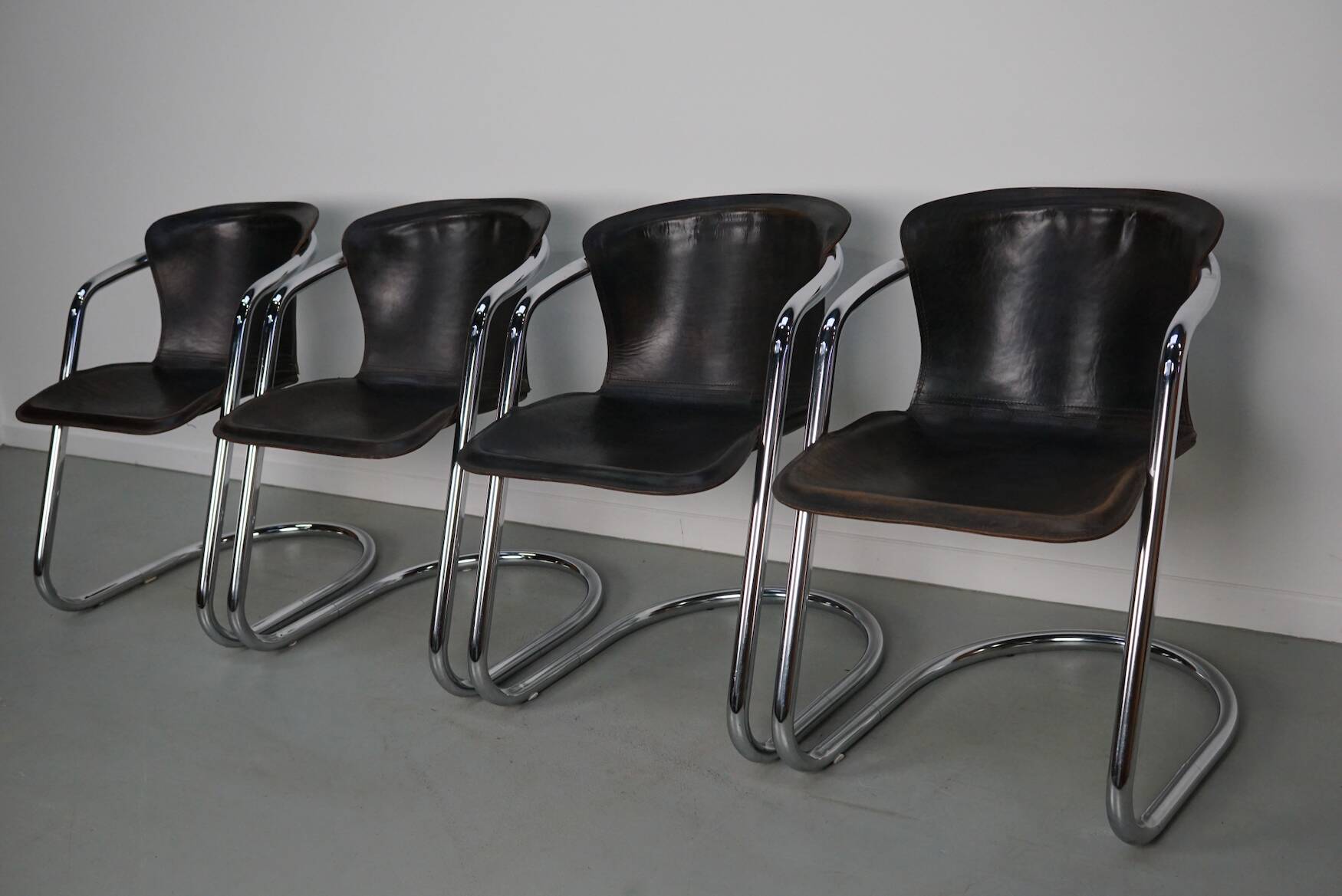 Set of four brown leather dining chairs, Willy Rizzo, 1970