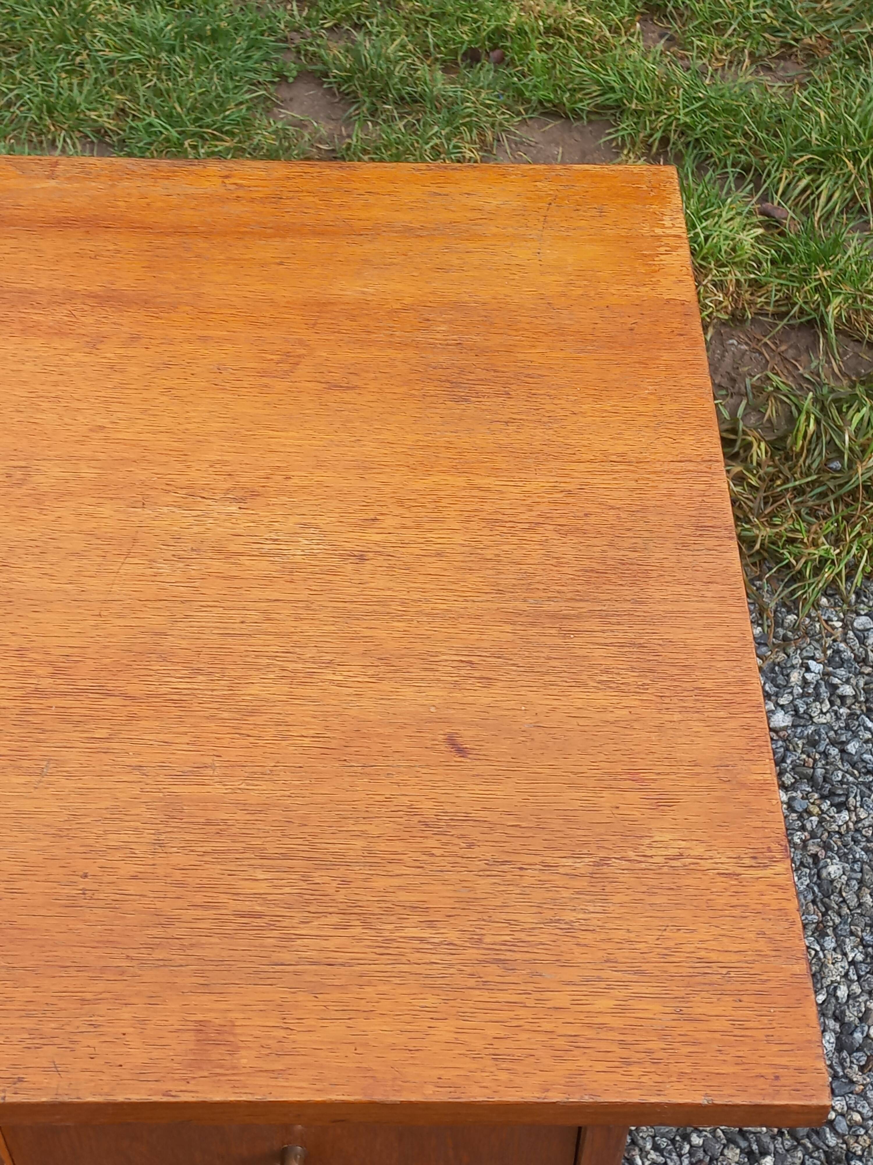 Vintage oak desk with a metallic base from the 1960s.