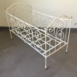 White wrought iron folding bed