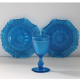 Old table set in blue pressed moulded glass