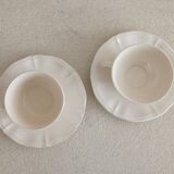Two ivory cups and saucers from Sarreguemines