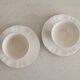 Two ivory cups and saucers from Sarreguemines