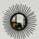 Vintage black and gold metal sun mirror from the 1960s.