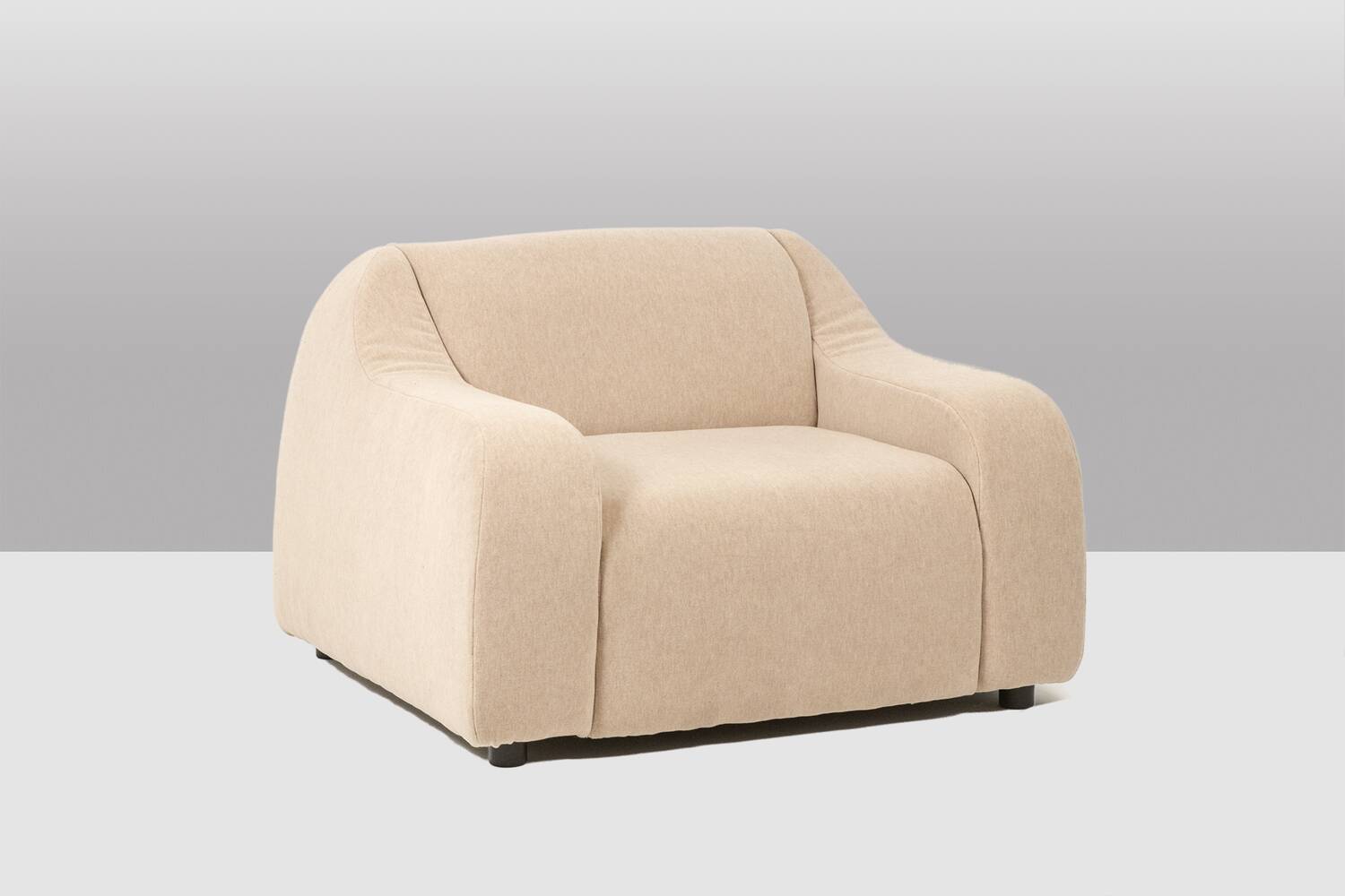 A pair of large and comfortable beige fabric armchairs. Contemporary.