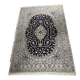 Hand-knotted Nain Persian rug with blue and white floral design