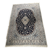 Hand-knotted Nain Persian rug with blue and white floral design