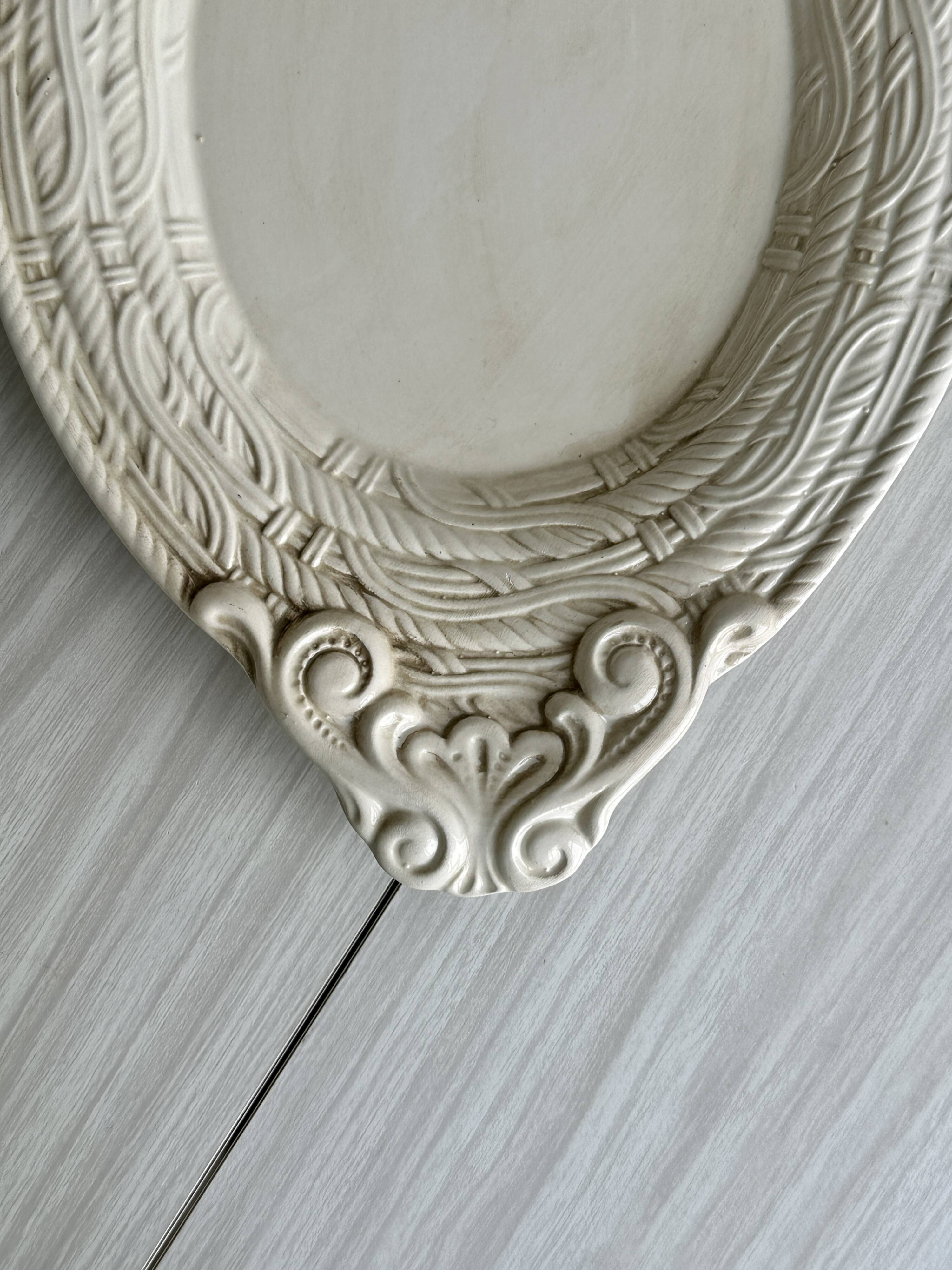 Large oval dish in sculpted white ceramic