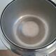 Vintage chrome metal floor ashtray with integrated tray.
