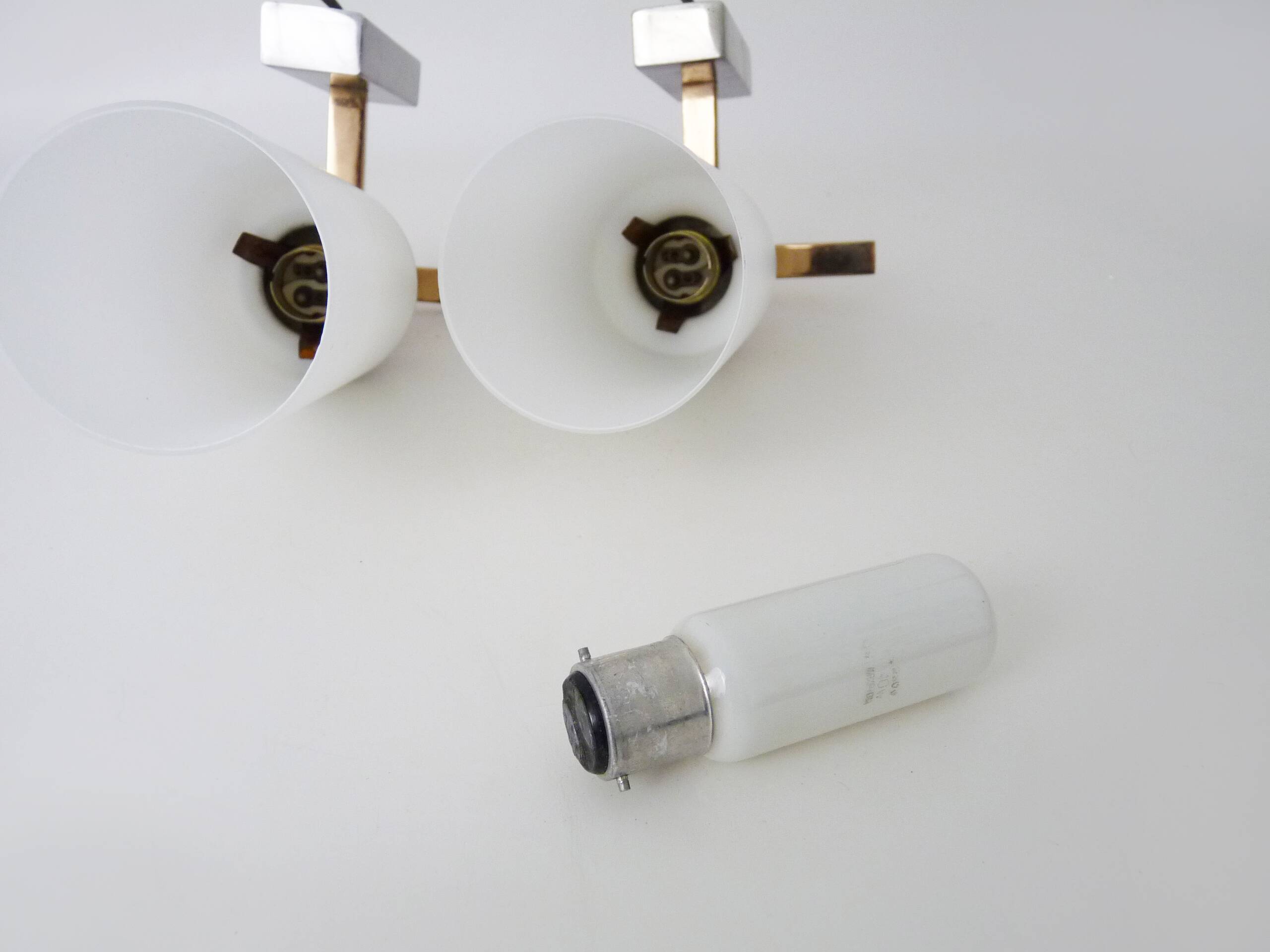 Pair of chrome-plated metal and opaline brass wall lights. 1960s