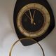 Pendule murale formica noire et or marque Trophy Transistor