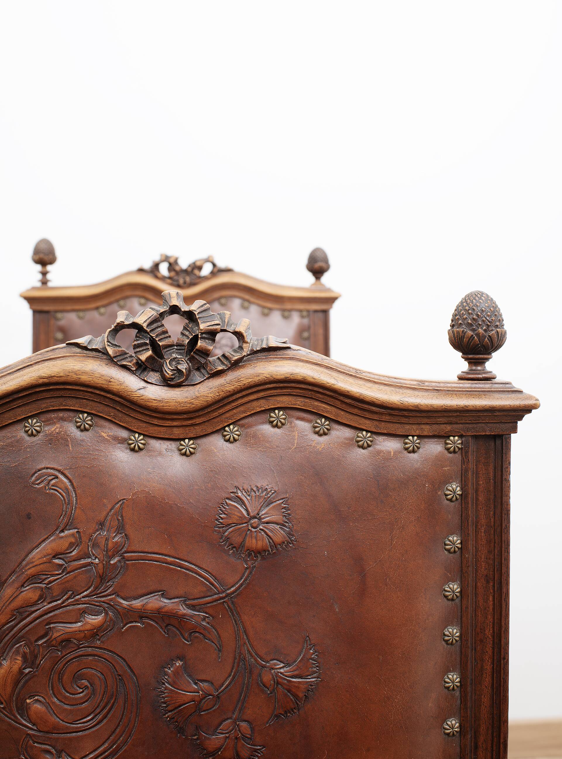 Set of 4 Louis XVI style chairs in carved wood and embossed leather.