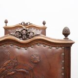 Set of 4 Louis XVI style chairs in carved wood and embossed leather.